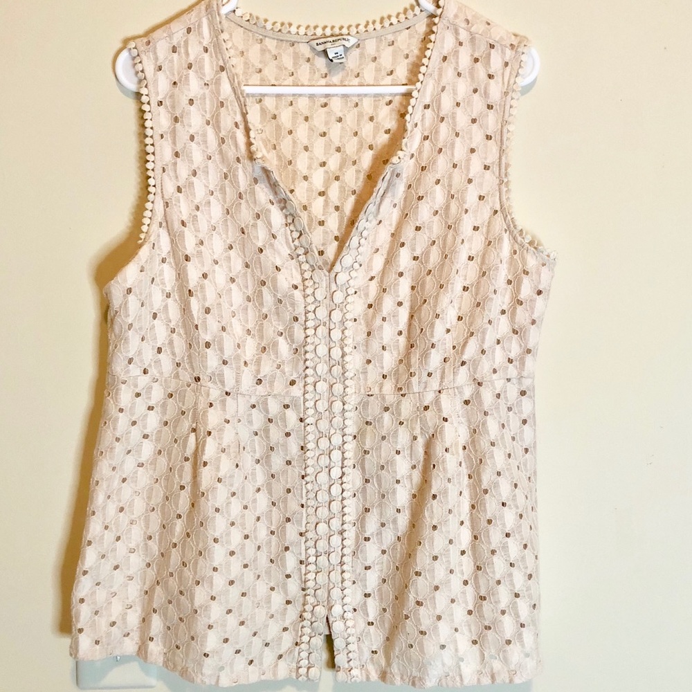 Cream sleeveless blouse